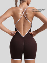 Cross-back jumpsuit showing spaghetti straps and sporty modern edge