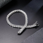 Classic tennis bracelet detail showing 4MM round CZ stones in claw settings