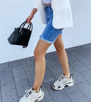 Medium wash denim shorts with lived-in, vintage-inspired look