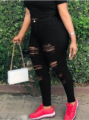 Black ripped jeans with side zipper closure