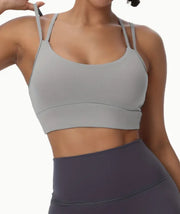 Padded sports bra featuring open criss-cross back straps