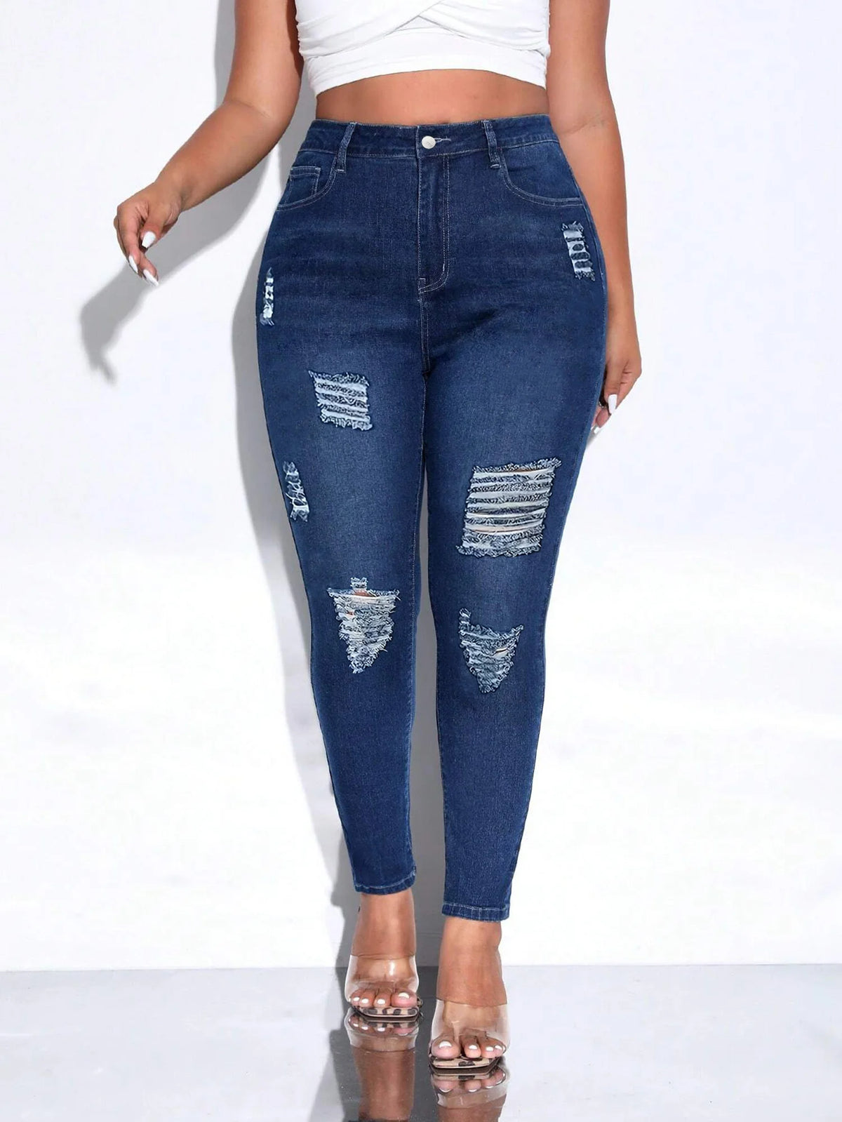 Women's distressed skinny denim pencil pants in navy with mid-rise waist