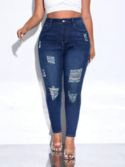 Women's distressed skinny denim pencil pants in navy with mid-rise waist