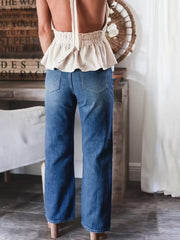 Wide-leg denim pants showing functional pockets detail