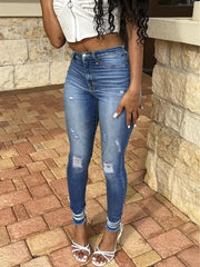 Distressed ripped detailing on high-stretch denim jeans