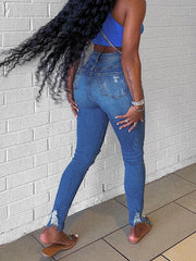 Mid-waist stretchy denim jeans in dark blue with a stone wash finish