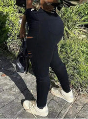 Stretchy black skinny jeans with elastic waist give