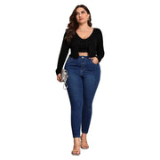 Plus size dark blue jeans with clean zipper fly closure