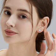 Moissanite stud earrings available in silver, gold, and rhodium plated finishes