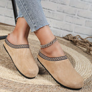 Cozy velvet home slippers with closed-toe round shape for warmth
