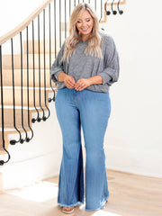 High Waist Flare Jeans in light bleach wash with zipper fly closure