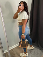 Full-length blue denim jeans in a flattering pencil silhouette