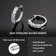 VVS moissanite huggie hoops with prong claw setting catching the light
