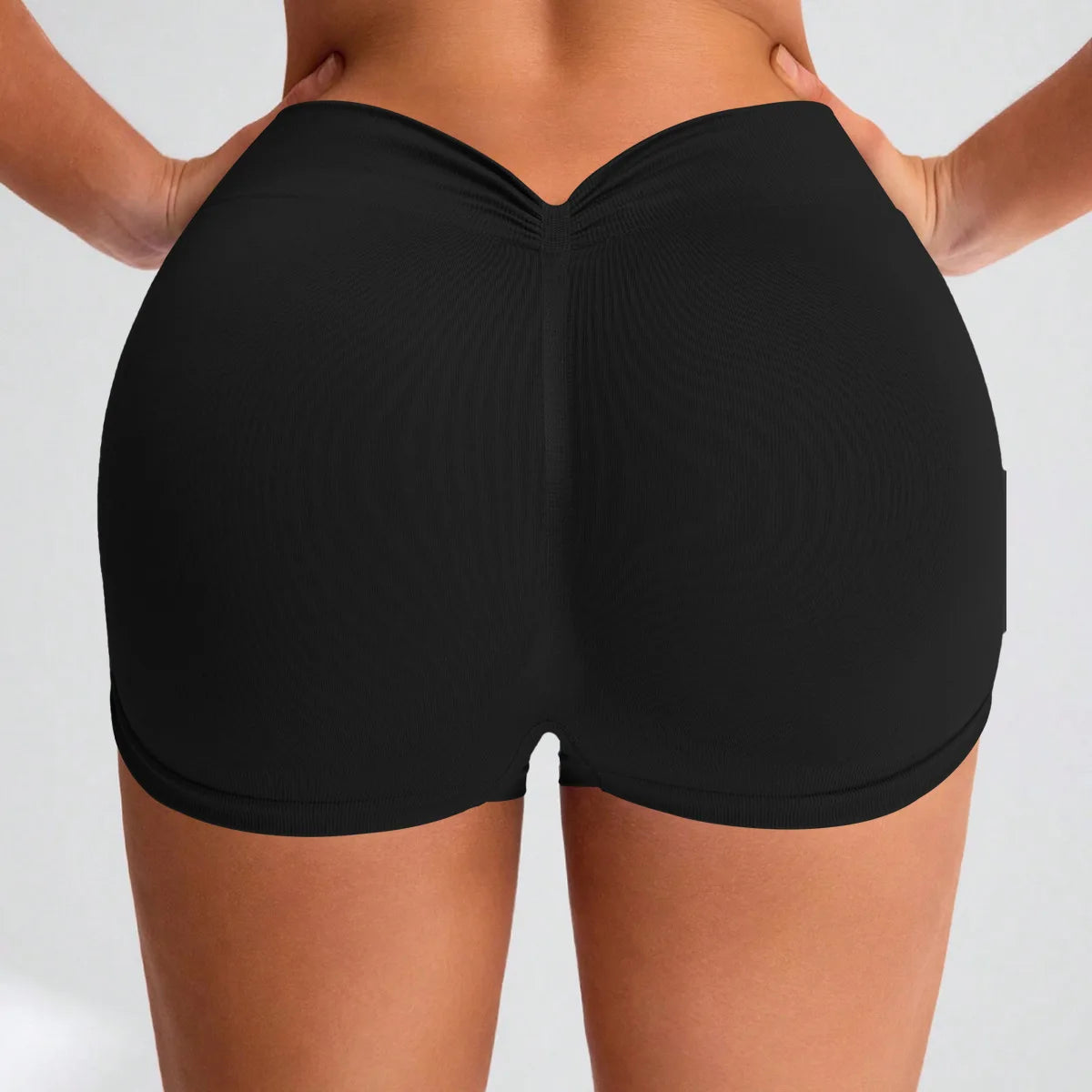 Black scrunch butt workout shorts with seamless mid-rise fit