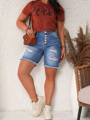 Medium-wash ripped denim shorts with a flattering high waist
