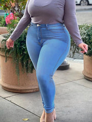 Plus Size denim pencil pants featuring a zipper fly closure