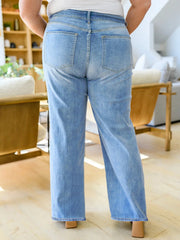 Plus size high waisted jeans in classic solid medium wash