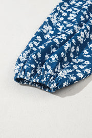 Blue ditsy floral blouse with feminine round neckline detail