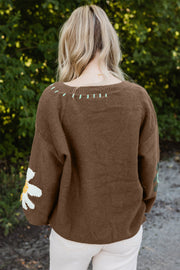 Floral drop-shoulder sweater with loose, oversized silhouette