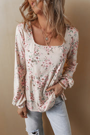 Pink floral long sleeve blouse with puff sleeve styling