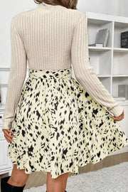 Ribbed knit mini dress featuring long sleeves and high neck