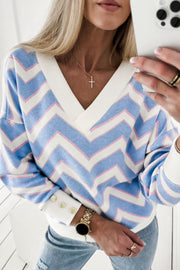 Sky blue zigzag stripe top showing the flattering V-neckline and relaxed drape