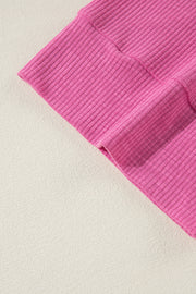 Bright Pink oversize V-neck top styled for day to night