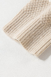 Khaki knit sweater close-up on chunky cable texture and fabric