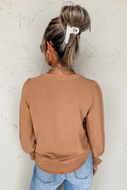 Shirred cuff notch V-neck blouse in a relaxed shift silhouette