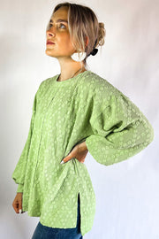 Light Green blouse showing side split detail and raw hem