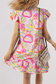 Abstract floral mini dress showing V-neckline and button details