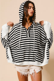 Striped hooded henley top showing buttoned neckline and cozy hood