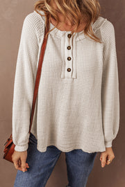 Relaxed oatmeal blouse with sloping raglan sleeves and soft stretch waffle knit