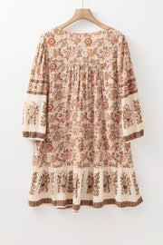 Apricot floral mini dress with playful fringe tassel detail