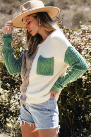 Colorblock pullover sweater showing functional patched pockets detail
