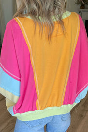 Plus size sweatshirt showing colorblock patchwork detail and round neck