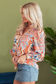 Long sleeve floral blouse featuring feminine shirred cuff detail
