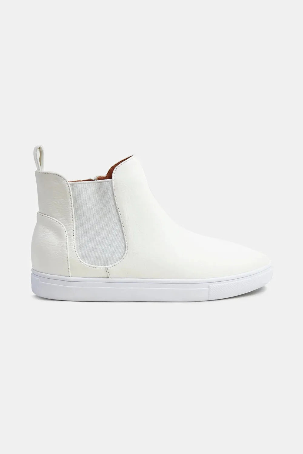 White faux suede slip-on sneaker with elastic side panels, shown in side profile