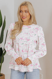 Pink floral babydoll blouse with long shirred balloon sleeves and round neckline