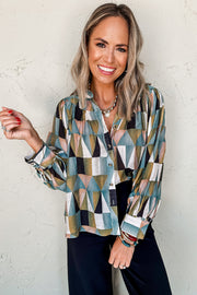 Green geometric shirt showing shirt collar and button-front closure