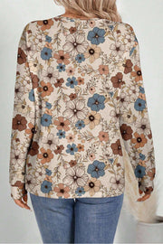 Loose floral print top with full-length sleeves and round neckline