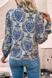 Bohemian bishop sleeve shirt showing delicate lace splicing detail