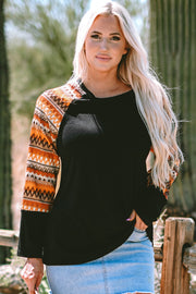 Round neck geo print top with colorblock patchwork sleeves