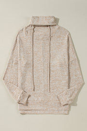 Relaxed apricot cowl neck top layered over jeans