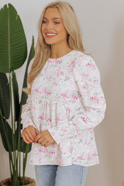 Pink floral babydoll blouse with flowy shift silhouette