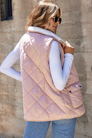 Sleeveless quilted vest coat showing side pockets and relaxed shift silhouette