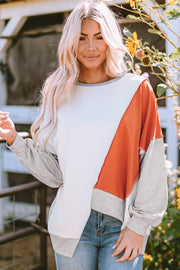 Long sleeve patchwork top with eye-catching irregular hem