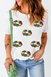 Close-up of multicolor sequin detailing on white crew neck tee