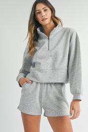 Light grey short set showing roomy lounge-ready silhouette