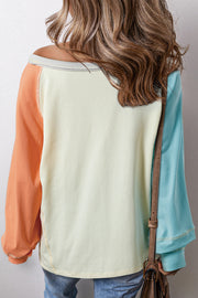 Colorblock crew neck top showing raglan long sleeves